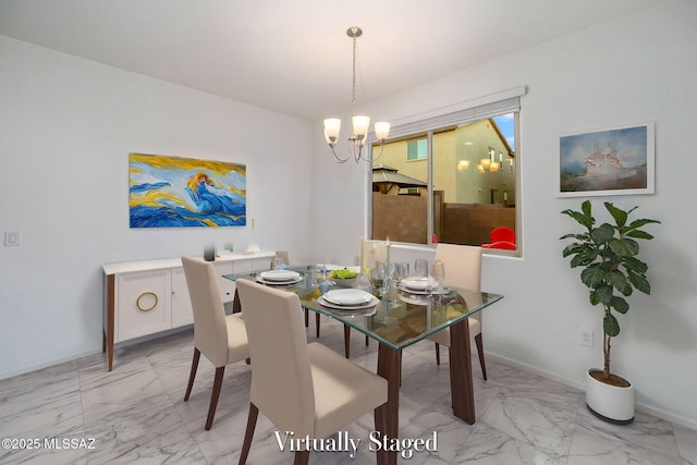 dining room with baseboards, marble finish floor, and an inviting chandelier