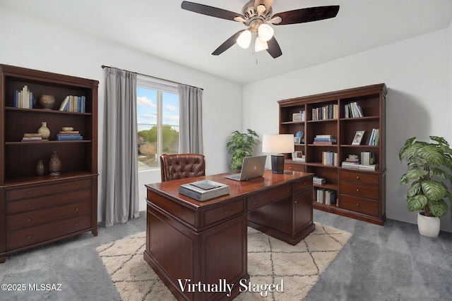 home office with light carpet and a ceiling fan