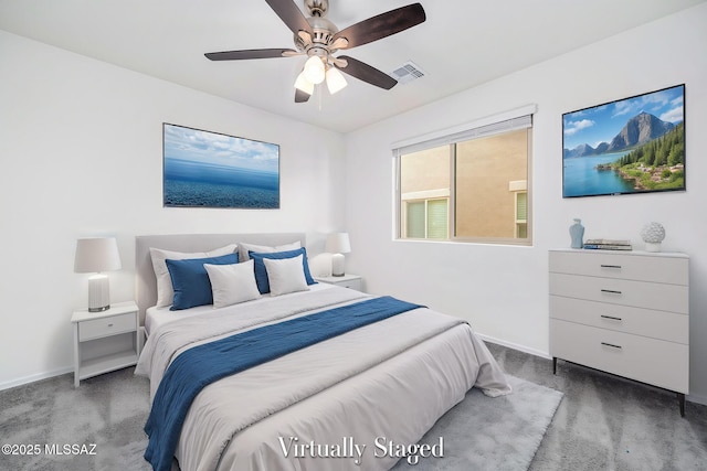 carpeted bedroom featuring baseboards, visible vents, and ceiling fan