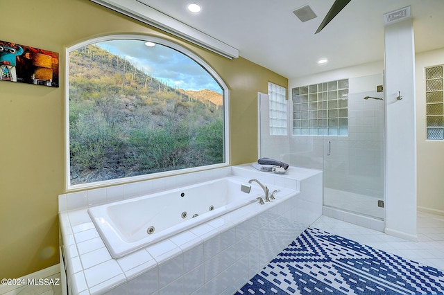 bathroom featuring a stall shower, recessed lighting, a tub with jets, tile patterned flooring, and baseboards