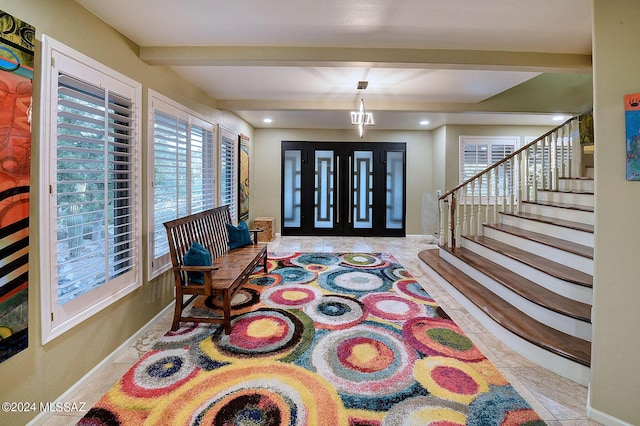 entryway featuring stairway, beamed ceiling, recessed lighting, and baseboards