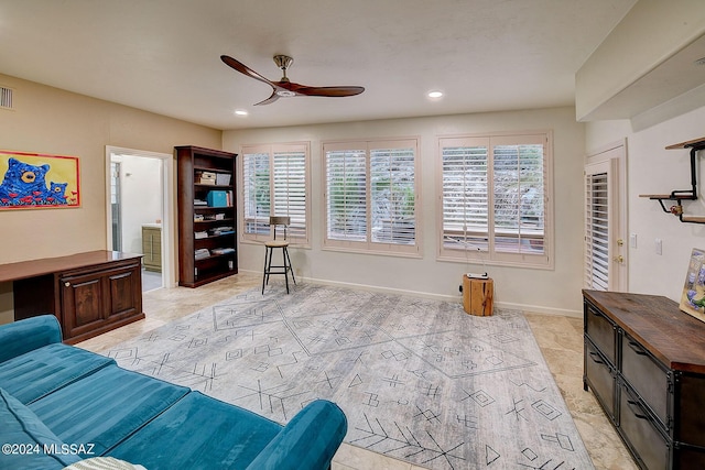 living area with visible vents, recessed lighting, baseboards, and a ceiling fan