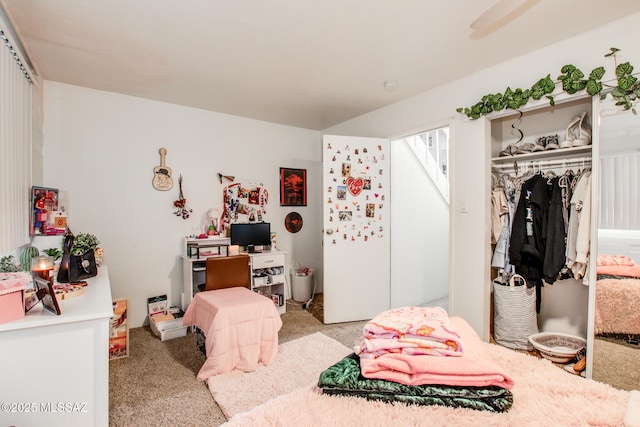 carpeted bedroom with a closet