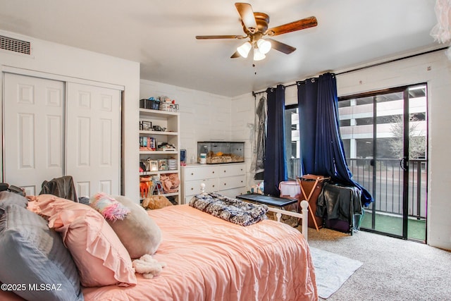 bedroom with access to exterior, carpet, a closet, visible vents, and a ceiling fan