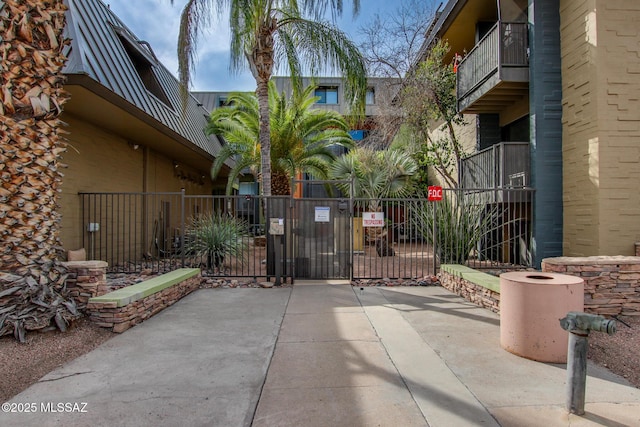 view of gate featuring fence