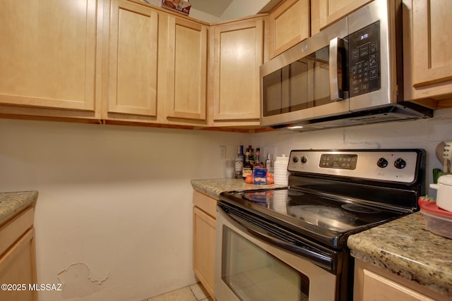 kitchen with stainless steel appliances and light brown cabinets