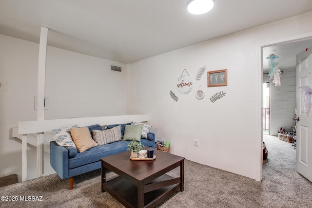 carpeted living room with visible vents