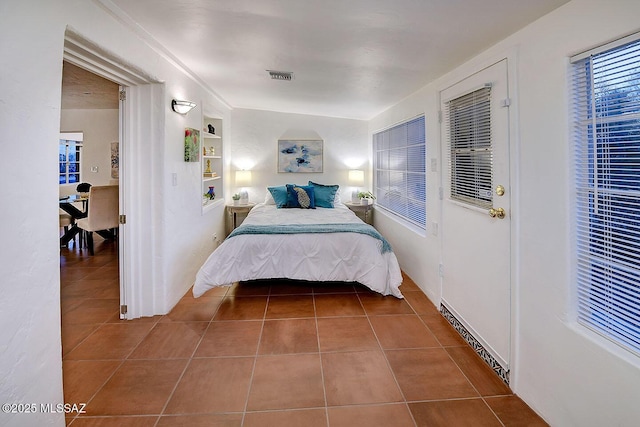 tiled bedroom with visible vents