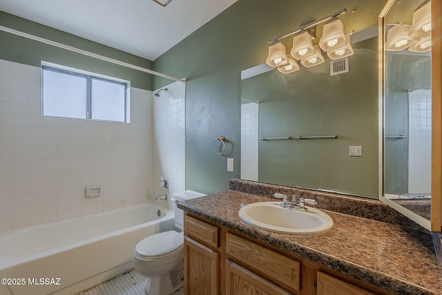 full bath featuring toilet, bathing tub / shower combination, vanity, visible vents, and tile patterned floors