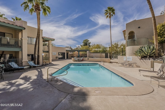 pool featuring a patio area