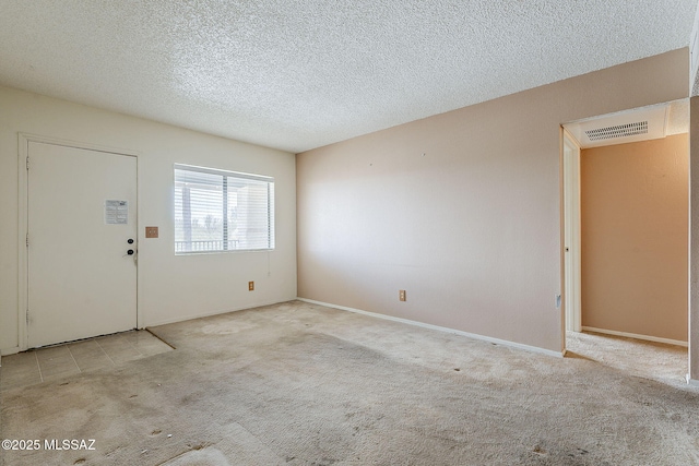 interior space featuring visible vents and a textured ceiling