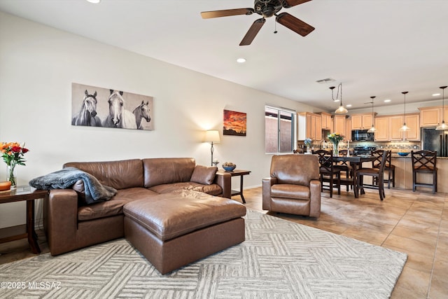 living room with ceiling fan, light tile patterned flooring, recessed lighting, visible vents, and baseboards