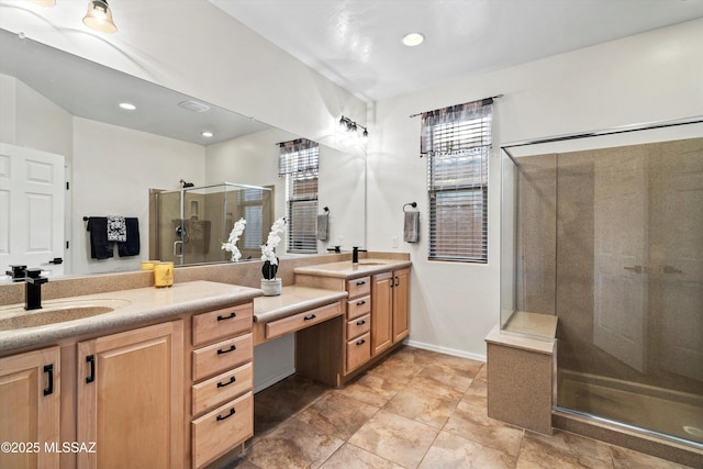 bathroom featuring recessed lighting, a shower stall, baseboards, and vanity