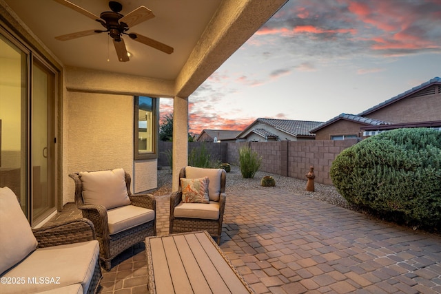 view of patio / terrace with a fenced backyard, ceiling fan, and outdoor lounge area