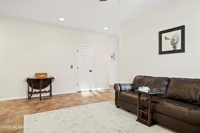 living room featuring ceiling fan, baseboards, and recessed lighting