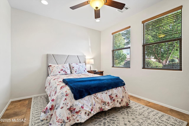 tiled bedroom featuring a ceiling fan, recessed lighting, visible vents, and baseboards