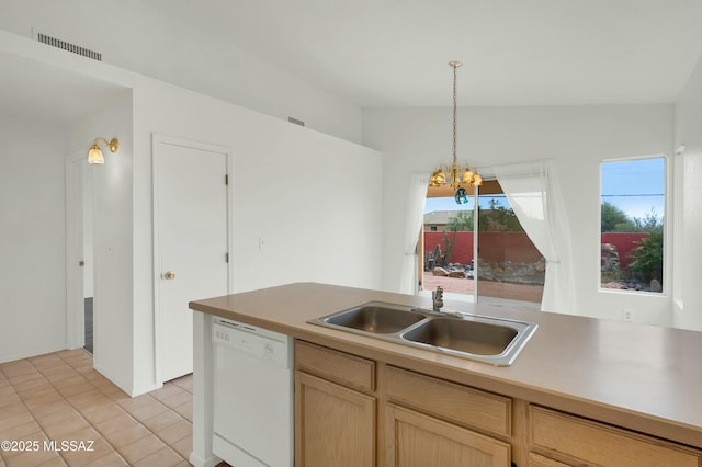 kitchen with white dishwasher, a sink, visible vents, vaulted ceiling, and light brown cabinetry