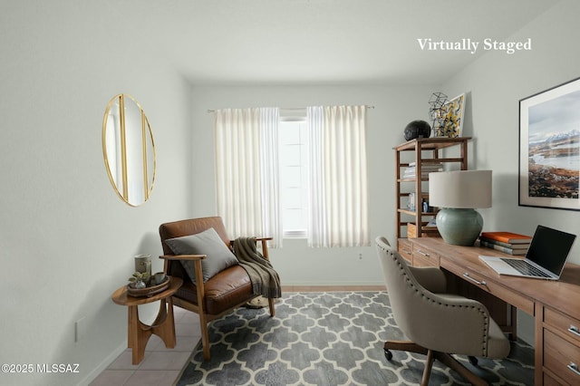 home office featuring light tile patterned flooring and baseboards