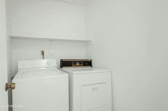 clothes washing area with laundry area and washing machine and clothes dryer