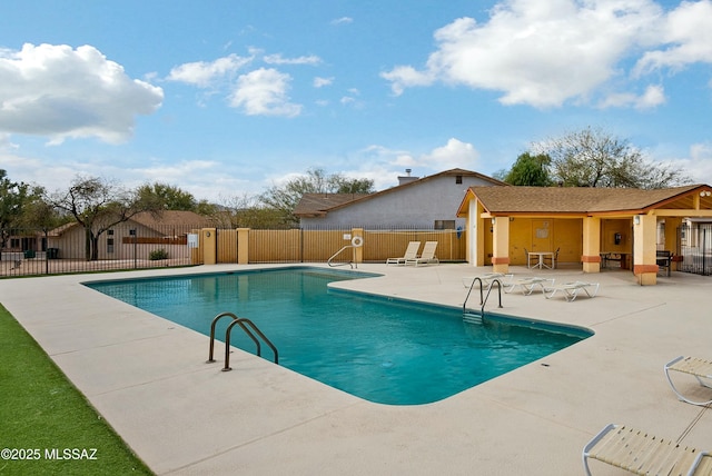 pool featuring a patio area and fence