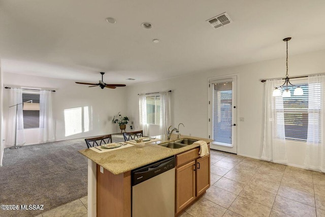 60579 E Flank Strap Dr, Tucson, AZ 85739 - kitchen with a sink, visible vents, dishwasher, plenty of natural light, and pendant lighting