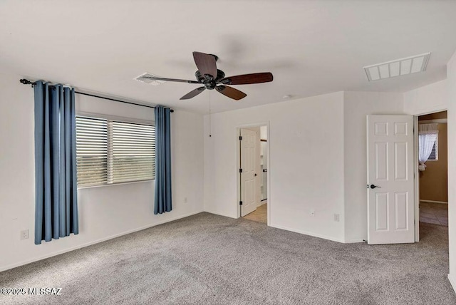 60579 E Flank Strap Dr, Tucson, AZ 85739 - carpeted empty room featuring ceiling fan, visible vents, and baseboards