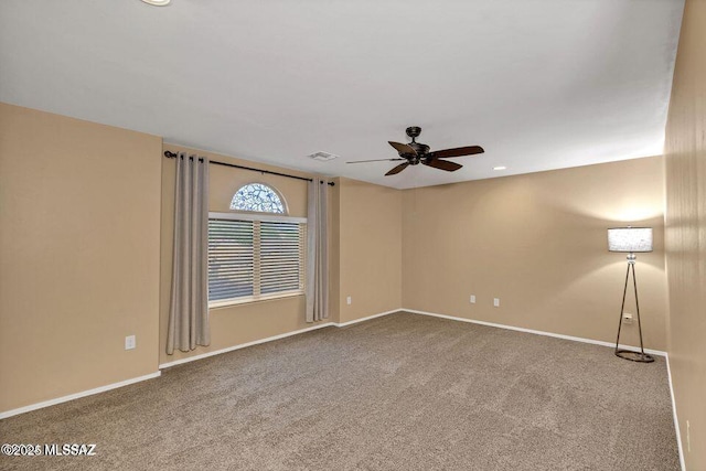 60579 E Flank Strap Dr, Tucson, AZ 85739 - spare room with carpet, baseboards, visible vents, and a ceiling fan