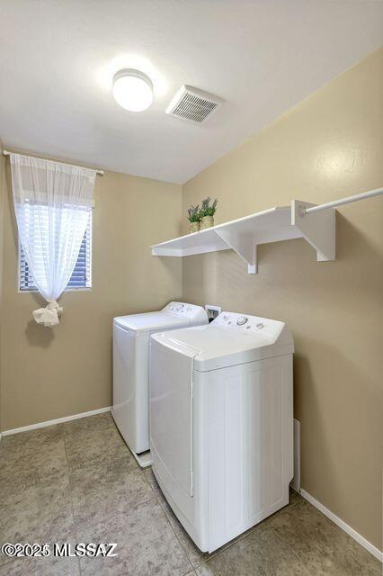 60579 E Flank Strap Dr, Tucson, AZ 85739 - clothes washing area featuring laundry area, baseboards, visible vents, and washer and dryer