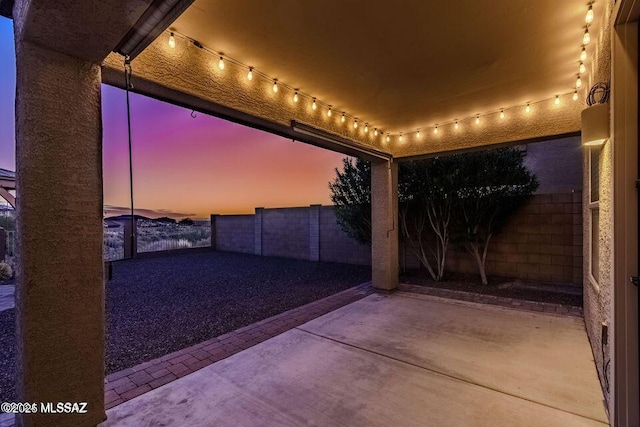 60579 E Flank Strap Dr, Tucson, AZ 85739 - patio terrace at dusk with a fenced backyard