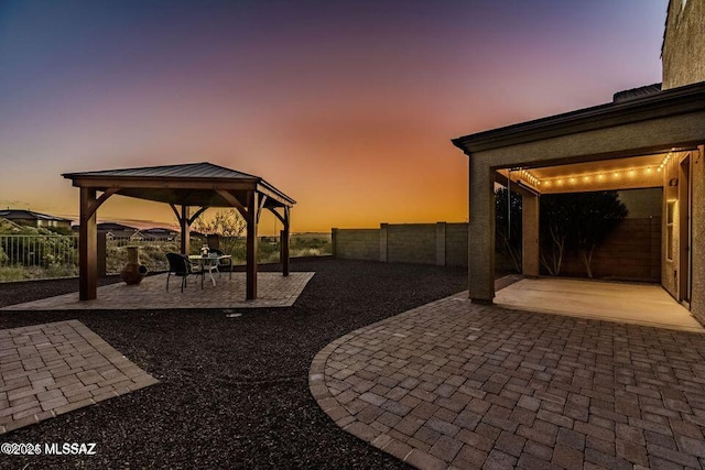 60579 E Flank Strap Dr, Tucson, AZ 85739 - view of patio featuring a fenced backyard and a gazebo