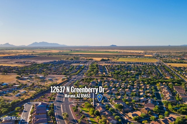 drone / aerial view featuring a residential view and a mountain view