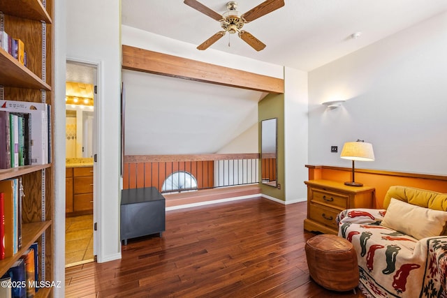 sitting room with lofted ceiling with beams, baseboards, a ceiling fan, and hardwood / wood-style flooring