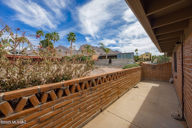 view of patio featuring a balcony