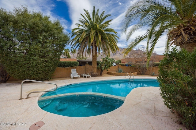 view of pool with a patio, a fenced backyard, and a fenced in pool