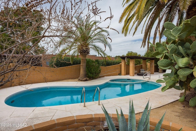 view of swimming pool with an in ground hot tub, a patio area, a fenced backyard, and a fenced in pool