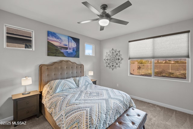 bedroom featuring ceiling fan, carpet flooring, and baseboards