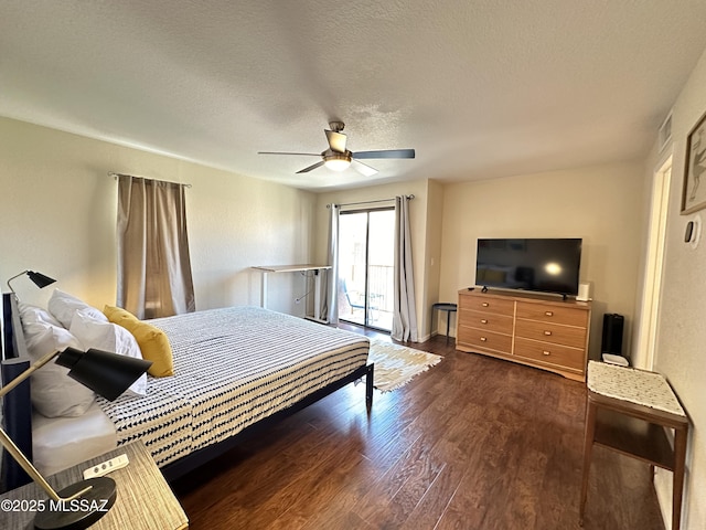 bedroom featuring a textured ceiling, ceiling fan, wood finished floors, visible vents, and access to exterior