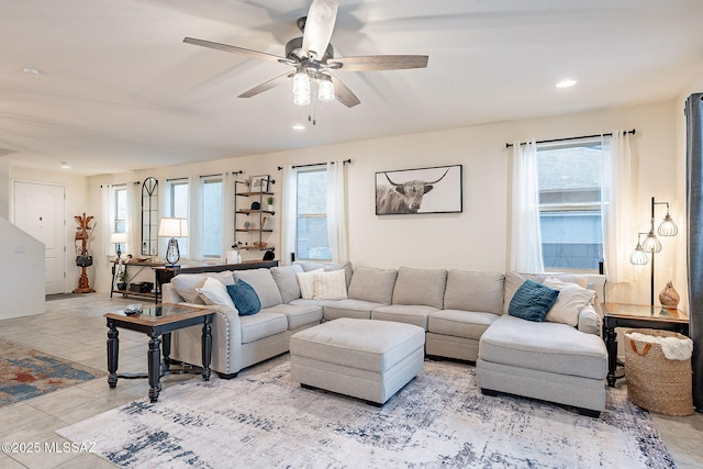 tiled living area with a ceiling fan, a wealth of natural light, and recessed lighting