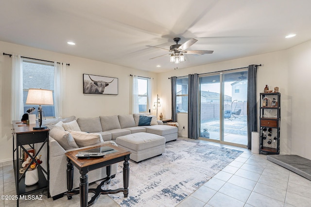 living room featuring recessed lighting, light tile patterned flooring, and ceiling fan