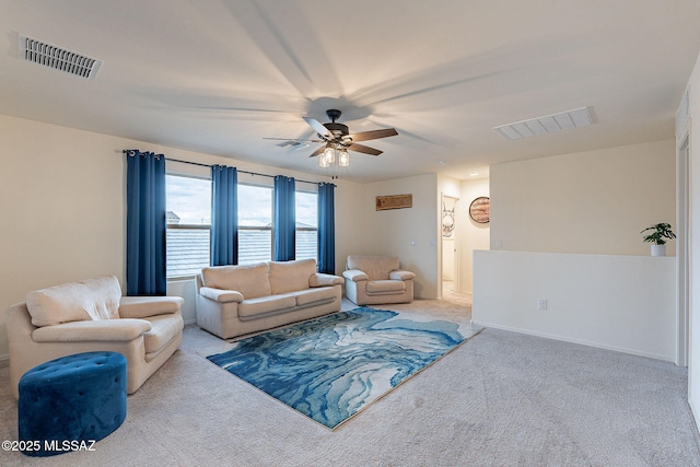 carpeted living area with ceiling fan, visible vents, and baseboards