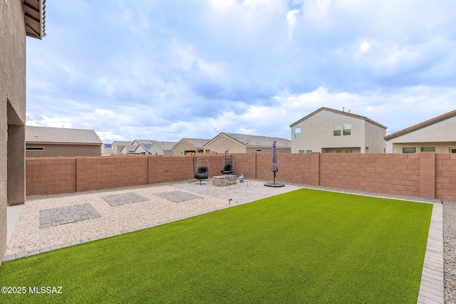 view of yard featuring a patio and a fenced backyard