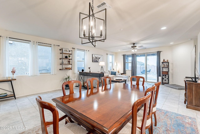 dining area with ceiling fan with notable chandelier, recessed lighting, visible vents, and light tile patterned floors