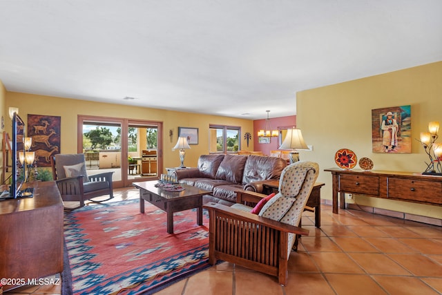 living room with an inviting chandelier, visible vents, and tile patterned floors