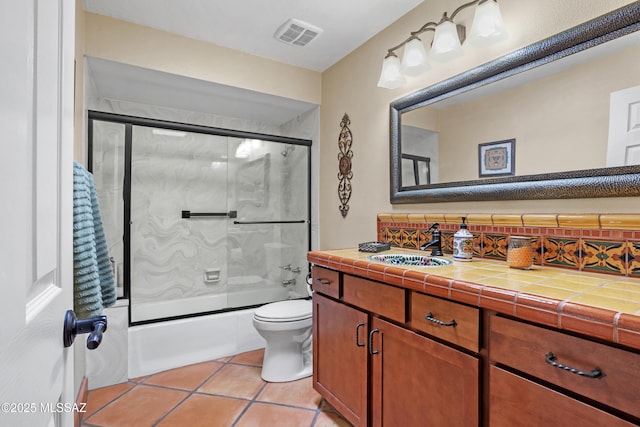 full bathroom with enclosed tub / shower combo, tile patterned flooring, toilet, vanity, and visible vents