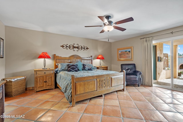 bedroom featuring light tile patterned floors, access to outside, and a ceiling fan