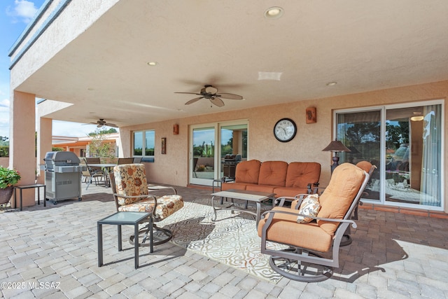 view of patio / terrace featuring an outdoor hangout area, ceiling fan, outdoor dining space, and area for grilling