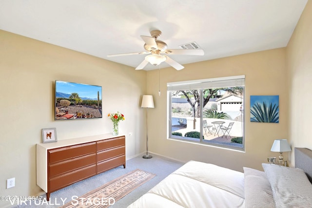 bedroom featuring visible vents, carpet flooring, baseboards, and ceiling fan