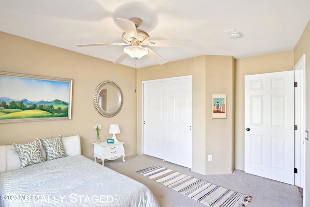 carpeted bedroom with ceiling fan