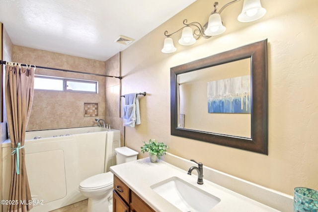 bathroom featuring visible vents, toilet, vanity, and shower / bath combination with curtain