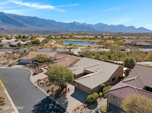 bird's eye view with a residential view and a water and mountain view